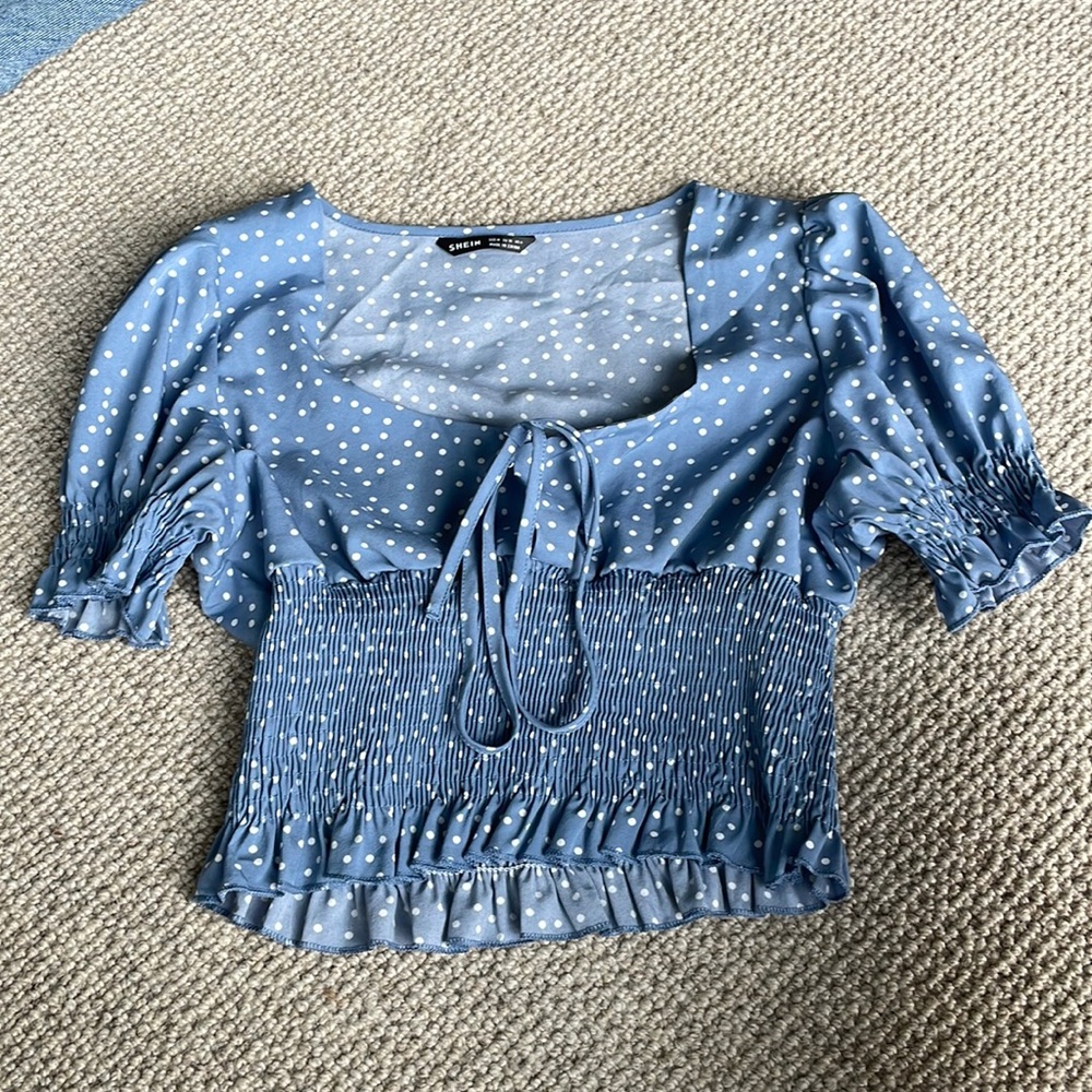 blue polkadotted shirt